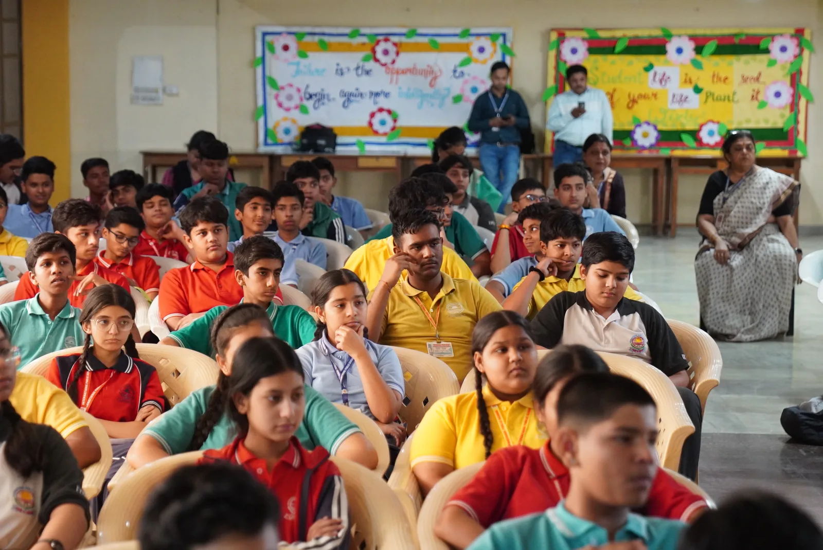 Students gathered for a session in a school hall