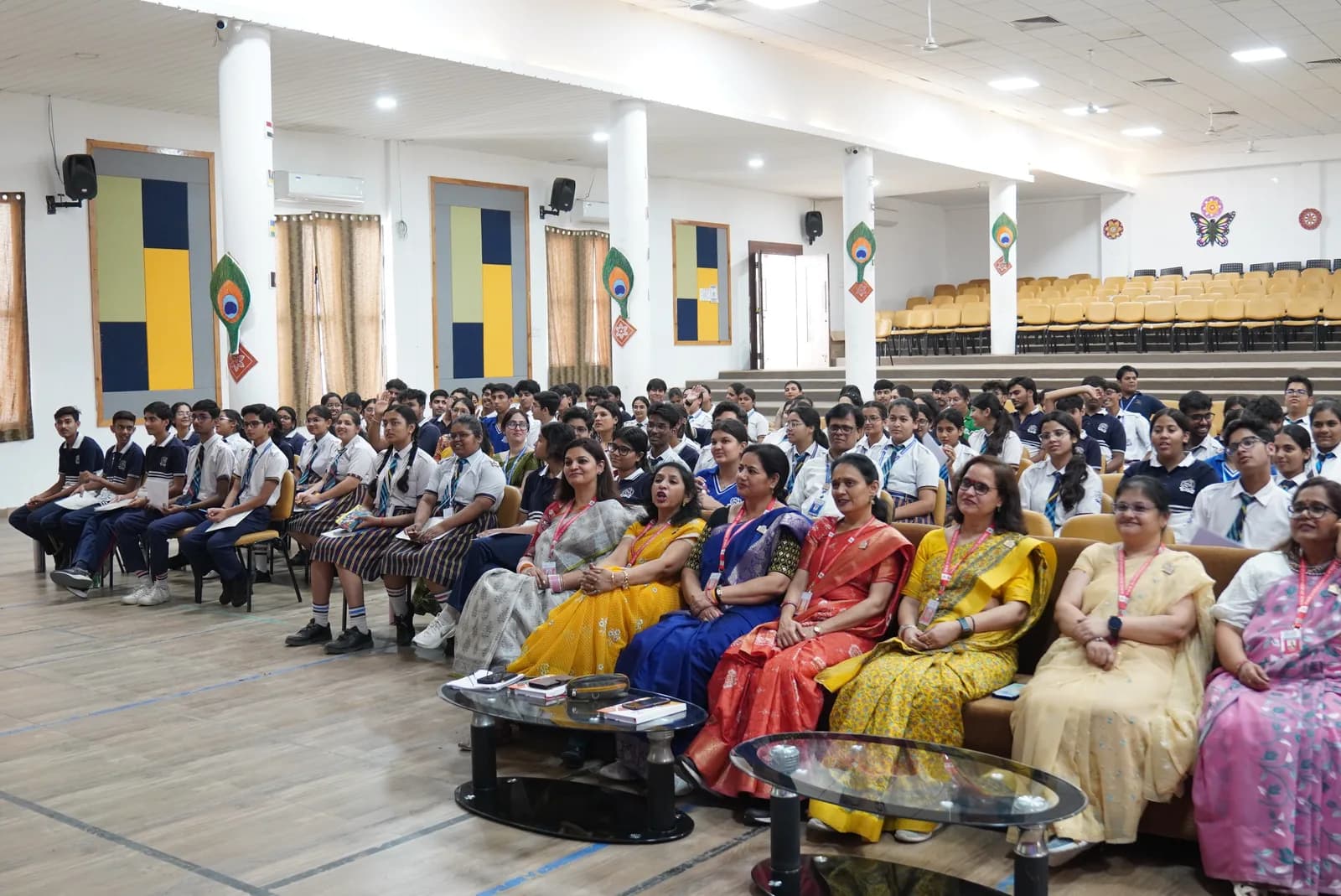 Students, teachers, and guests gathered in a school auditorium